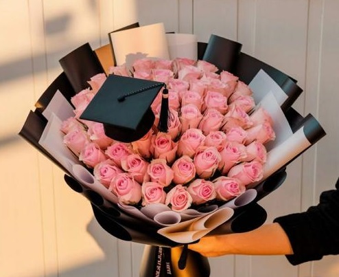 Colorful Celebration Basket - Mixed blue, red, and white flowers in decorative hexagonal basket